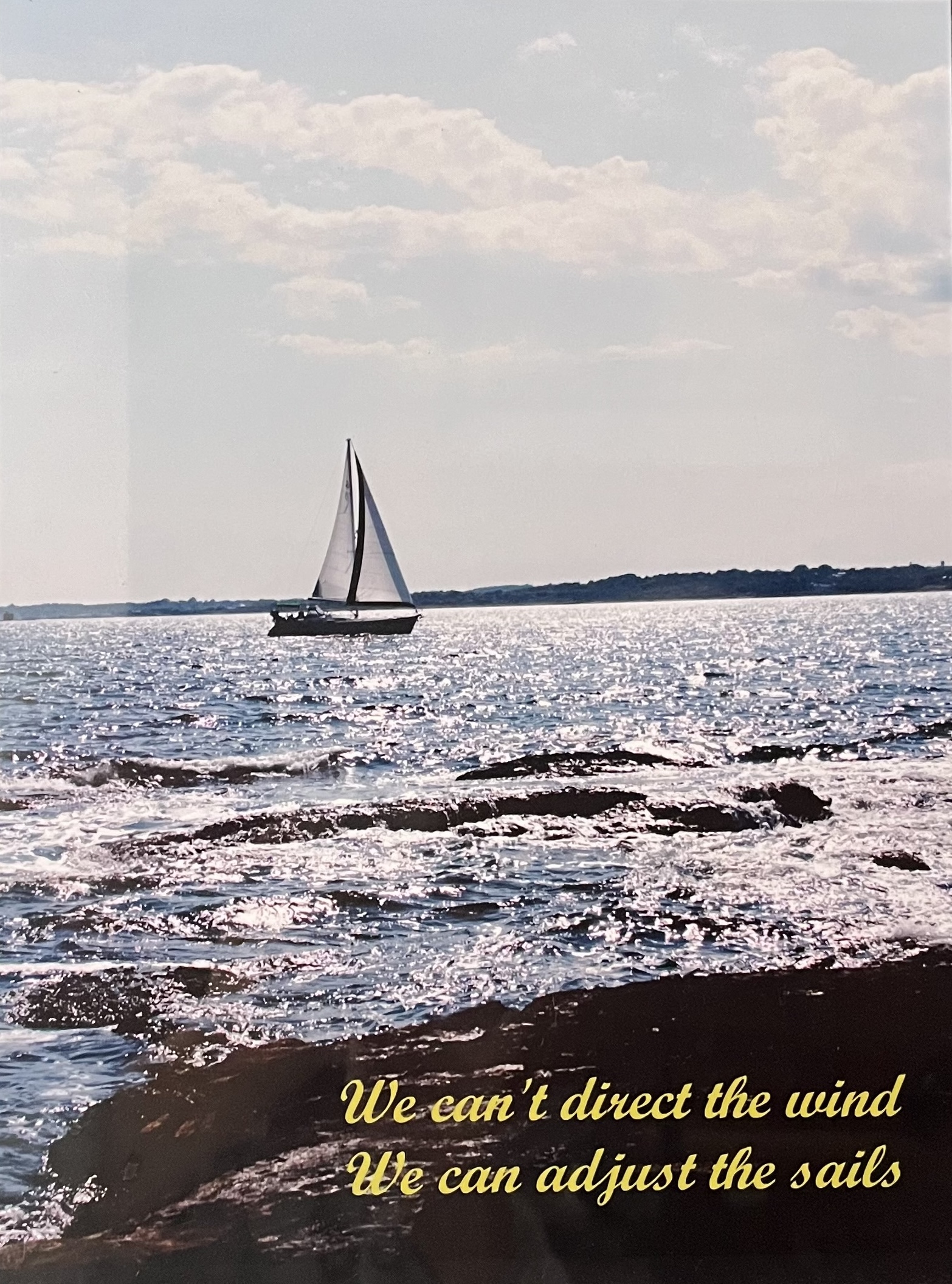 Sailboat at sunset with quote: We cannot direct the wind, but we can adjust the sails.
